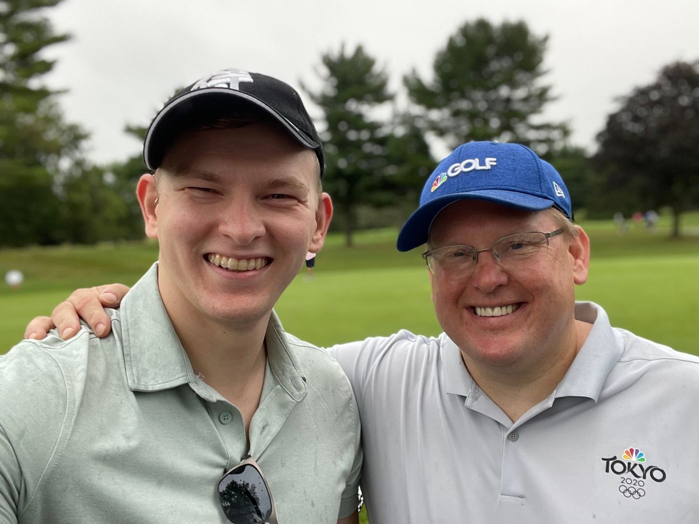 Jonathan and George Ruch in a selfie on a golf course